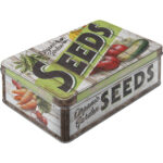 Plåtburk med grönsaker på och texten "seeds"